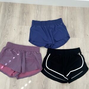 DSG stride high rise running shorts - Black, Purple, and Blue